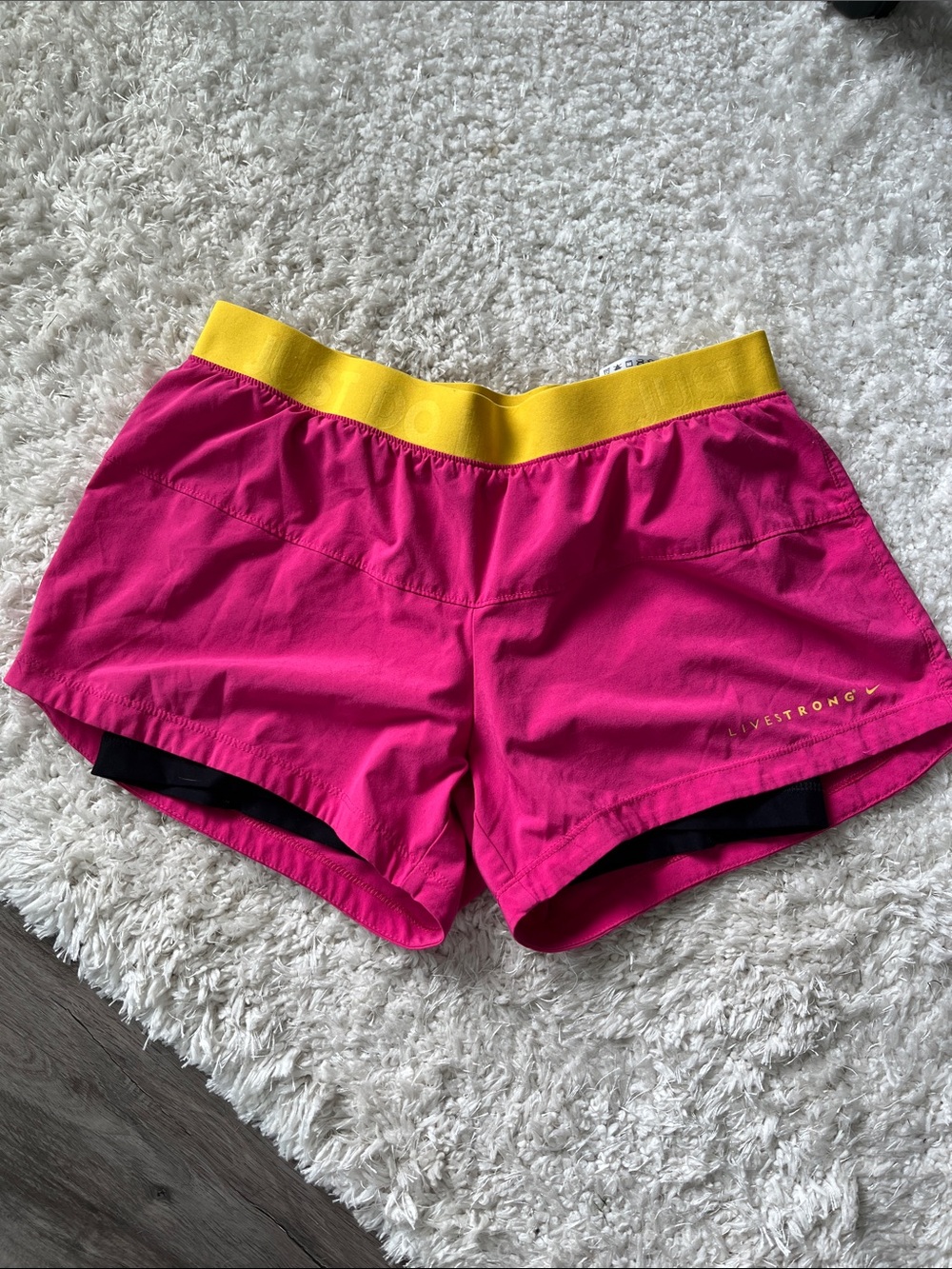 Nike Women’s Pink Athletic Shorts with Yellow Waistband